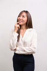 Fototapeta na wymiar Portrait of beautiful asian businesswoman over white background studio
