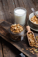 Granola with nuts, raisins and pumpkin seeds in a glass jar