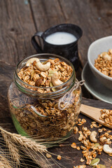 Granola with nuts, raisins and pumpkin seeds in a glass jar