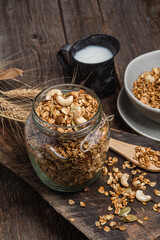 Granola with nuts, raisins and pumpkin seeds in a glass jar