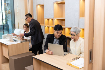 Asian professional team working. Business diverse corporate colleagues people. Employee corporate teamwork meeting in modern office.