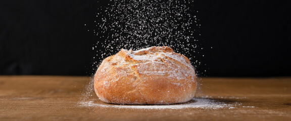 Bakery - freshly baked bread sprinkled with flour