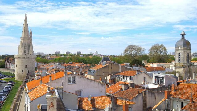 Lantern tower and Clocher Saint-Jean on a sunny day in La Rochelle, France