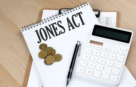JONES ACT text with chart and calculator and coins , business concept
