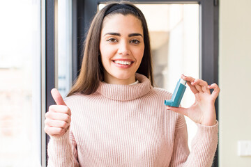 pretty young woman with an asthma inhaler. house interior design