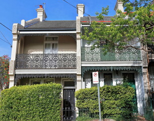 Victorian Filigree style terrace houses facades with high-pitch roofs on Ormond St., Paddington....
