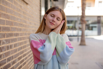 pretty young woman lazily early in the morning, waking and looking sleepy, tired and bored