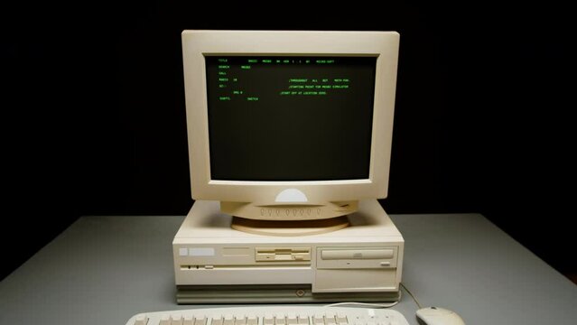 Retro pc with loading code console, programmer making scripts, green basic screen, Old computer studio close-up, Desktop vintage retro wave display, late 90s PC.