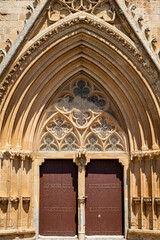 Pointed arch portal of Lala Mustafa Pasha Camii Mosque or old Cathedral of Saint Nicholas in Famagusta or Gazimagusa historical city centre, Northern Cyprus.