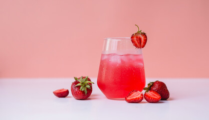 refreshing summer carbonated drink with berries and ice in a transparent glass