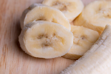 Fototapeta na wymiar Sliced ripe banana on a cutting board