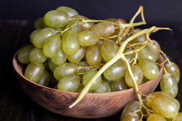 Ripe fresh grapes on a board