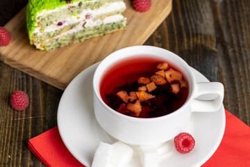 Red raspberry tea with pieces of fruit and berries