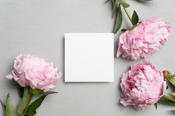 Invitation or greeting card mockup with fresh prony flowers, blank square card mock up