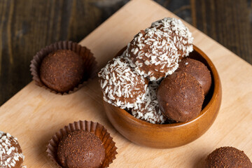 Chocolate candies with coconut flavor and filling