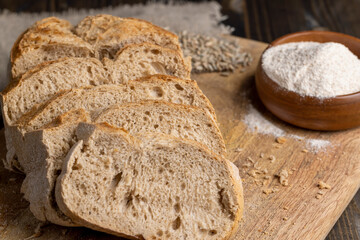 A loaf of bread made of wheat and rye flour cut into pieces