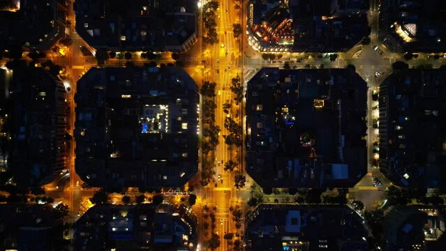 Central areas of Barcelona at night. Top view, filming from a drone.