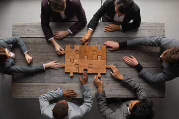 Business teamwork with puzzle - 617113873