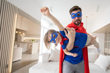 Father and son play superhero © alotofpeople