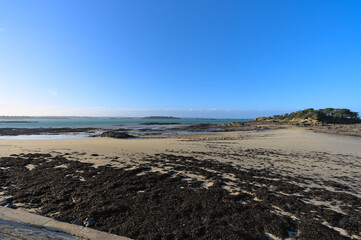 View of sand beach during low tide a winter sunny afternoon, Lancieux, Brittany, north of France