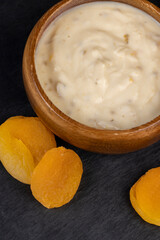 fresh yogurt made from milk with pieces of dried apricots