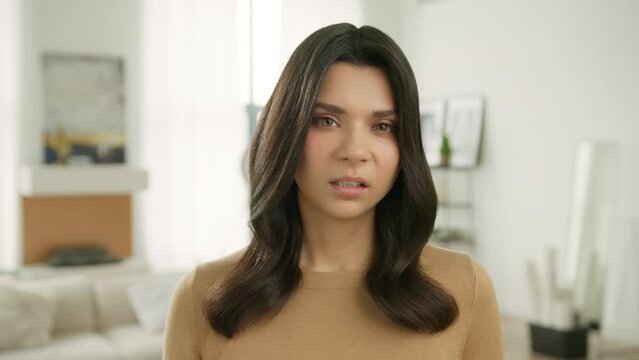 Young girl nasty face is angry and dissatisfied. Series of real people emotions and face expressions. Portrait of beautiful hateful woman feeling disgust and fury. Hate and anger concept slow motion