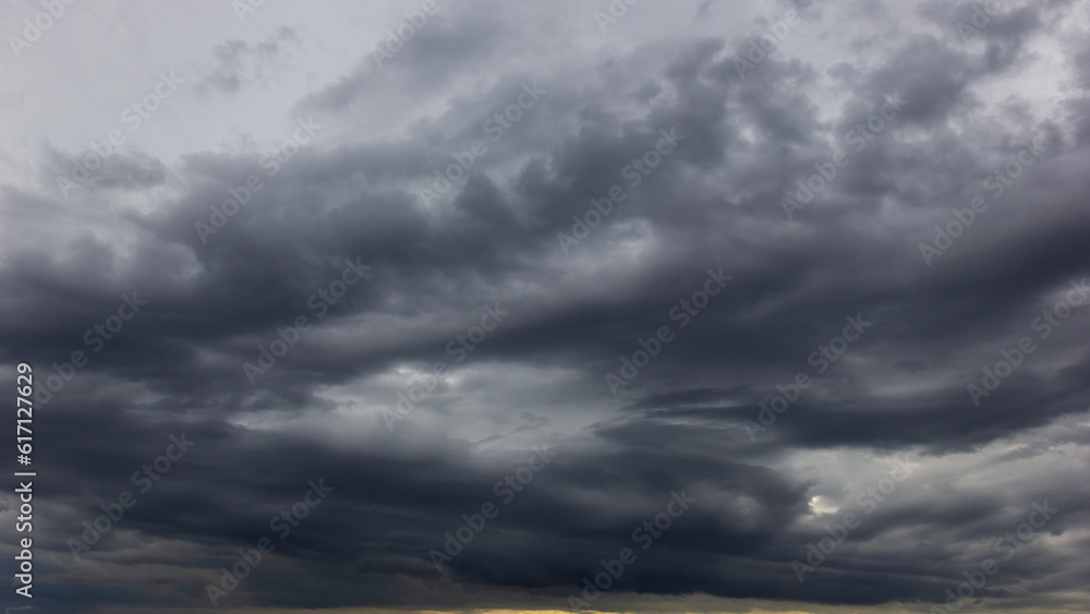 Aufkleber The dark sky with heavy clouds converging and a violent storm before the rain.Bad or moody weather sky and environment. carbon dioxide emissions, greenhouse effect, global warming, climate change