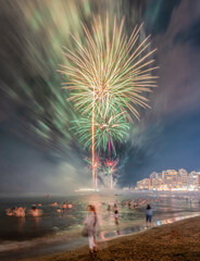 People enjoying the fireworks from the water on the night of San Juan at Las Canteras beach, Las...