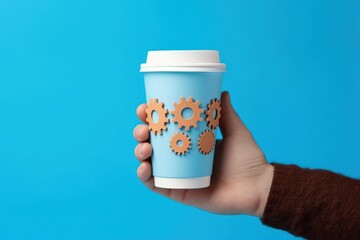 Hand holding coffee cup with gears, blue background, digital illustration. Generative AI