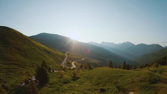 Col de Vars bathed in the gentle light of spring sunrise. The surrounding mountains come alive in the warm hues of morning, offering a breathtaking spectacle.