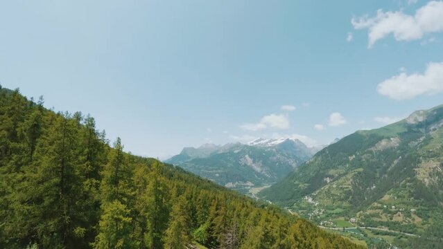 Explore the majestic larch forest in Orci&egrave;res 1850 valley. With FPV drone footage, immerse yourself in the heart of this alpine ecosystem