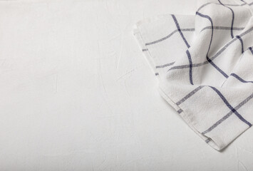 Obraz premium Kitchen towels on a marble background. New kitchen cotton towels on the kitchen table. Home textiles. Place for text. copy space.