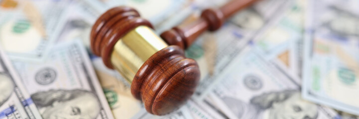 Judge gavel and pile of money banknotes