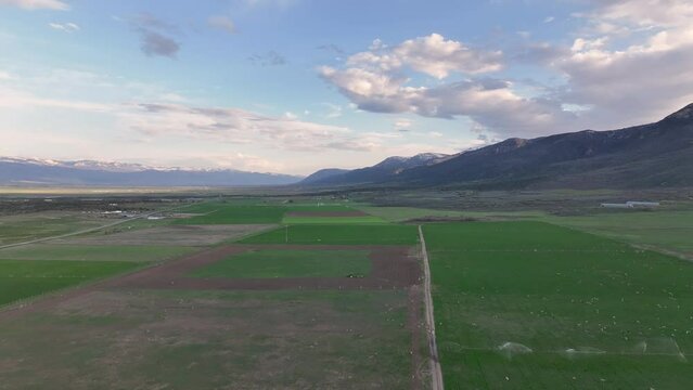 Aerial farming agriculture rural mountain valley U. Rural farming community agricultural economy. Spring summer season weather mountain valley agriculture field harvest. Seasonal. weather environment.