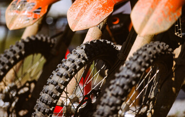 The front tires of three off-road motorbikes