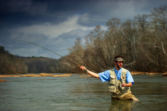 An Egyptian man casts a fly rod on the Chattahoochee River near Long Island Shoals, Atlanta, Georgia