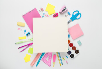 Various school stationery with space for text on color background, top view