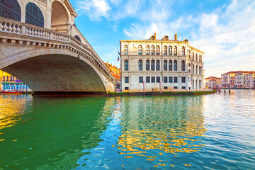 Obraz premium Sunrise view of beautiful Venice. Architecture and landmarks of Venice. Bridge Rialto in background , Italy