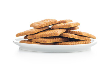 Sweet caramel biscuits. Tasty cookies on plate isolated on white background.