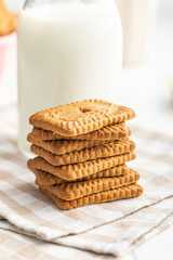Fototapeta na wymiar Sweet caramel biscuits. Tasty cookies on checkered napkin.