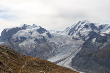 Panorama view with mountain Dufourspitze (left), Gorner Glacier and mountain Lyskamm (right) in mountain massif Monte Rosa in Pennine Alps, Switzerland