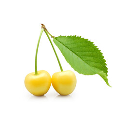 Two yellow sweet cherries with green leaf isolated on white background 
