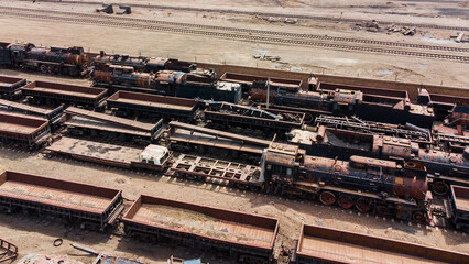 train yards with abandoned steam locomotives