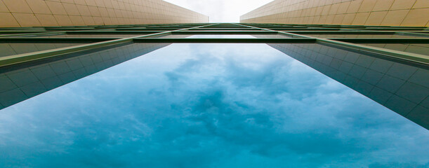 Banner, modern skyscrapers business office and residential buildings. Minimalism in urban architecture photography. Facade detail.