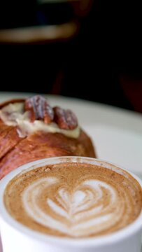 Cinemagraph - top view of served breakfast. Appetizing crunchy croissants with hot coffee, raspberries and walnuts. High quality 4k footage