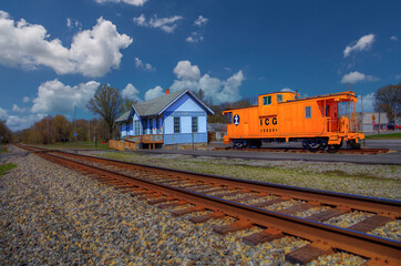 Ulin Station. An old railroad depot and caboose.   It now serves as the village hall and library. 