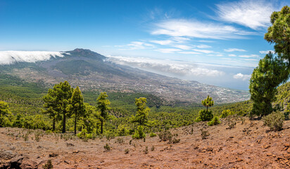 Clouds move over the mountain slope of Cumbre Nueva and flow into the valley like a waterfall, La Palma, Canary, Spain, Europe