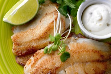 Crispy and Golden: Close-Up of Beer Battered Deep Fried Fish with Lemon in 4K Resolution