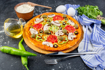 front view spicy mushroom pizza with red tomatoes bell peppers olives and mushrooms all sliced inside with eggs on the grey desk food pizza