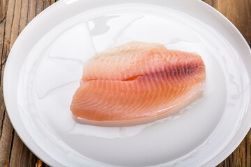 Artistry on a Plate: Close-Up of Fresh Tilapia Sashimi in 4K Resolution